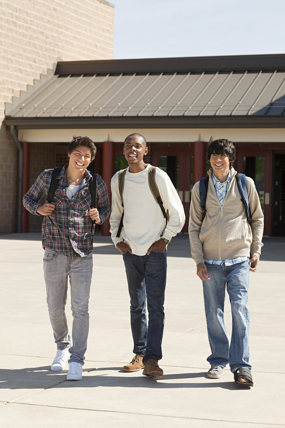 Courses three friends laughing and walking together outsid ryjskde.jpg